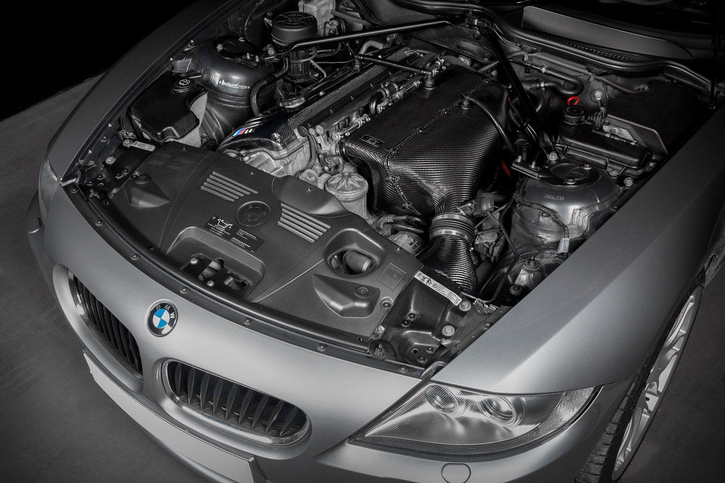 Eventuri hybrid carbon airbox system installed in BMW Z4 M engine bay, showcasing performance air intake components.