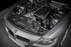 Eventuri hybrid carbon airbox system installed in BMW Z4 M engine bay, showcasing performance air intake components.