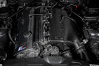 Eventuri hybrid carbon airbox system installed in BMW Z4 M engine bay, showcasing performance air intake components.