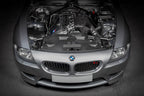 Eventuri hybrid carbon airbox system installed in BMW Z4 M engine bay, showcasing performance-enhancing engine components.
