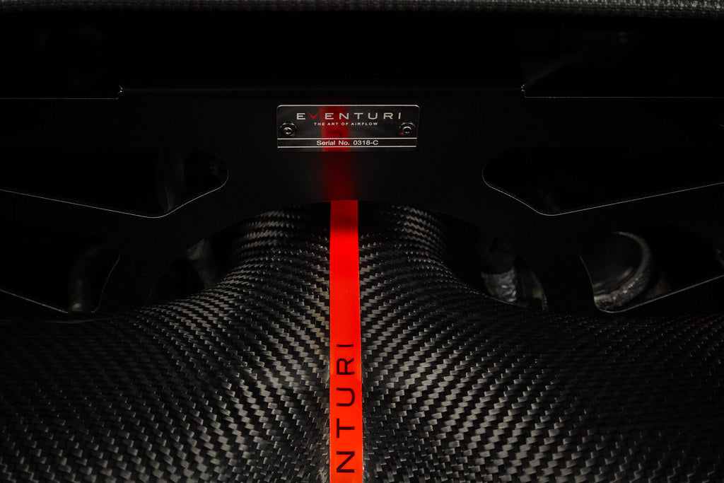 Eventuri carbon fiber intake system installed in a Chevrolet C8 Corvette Coupe with clear trunk panel