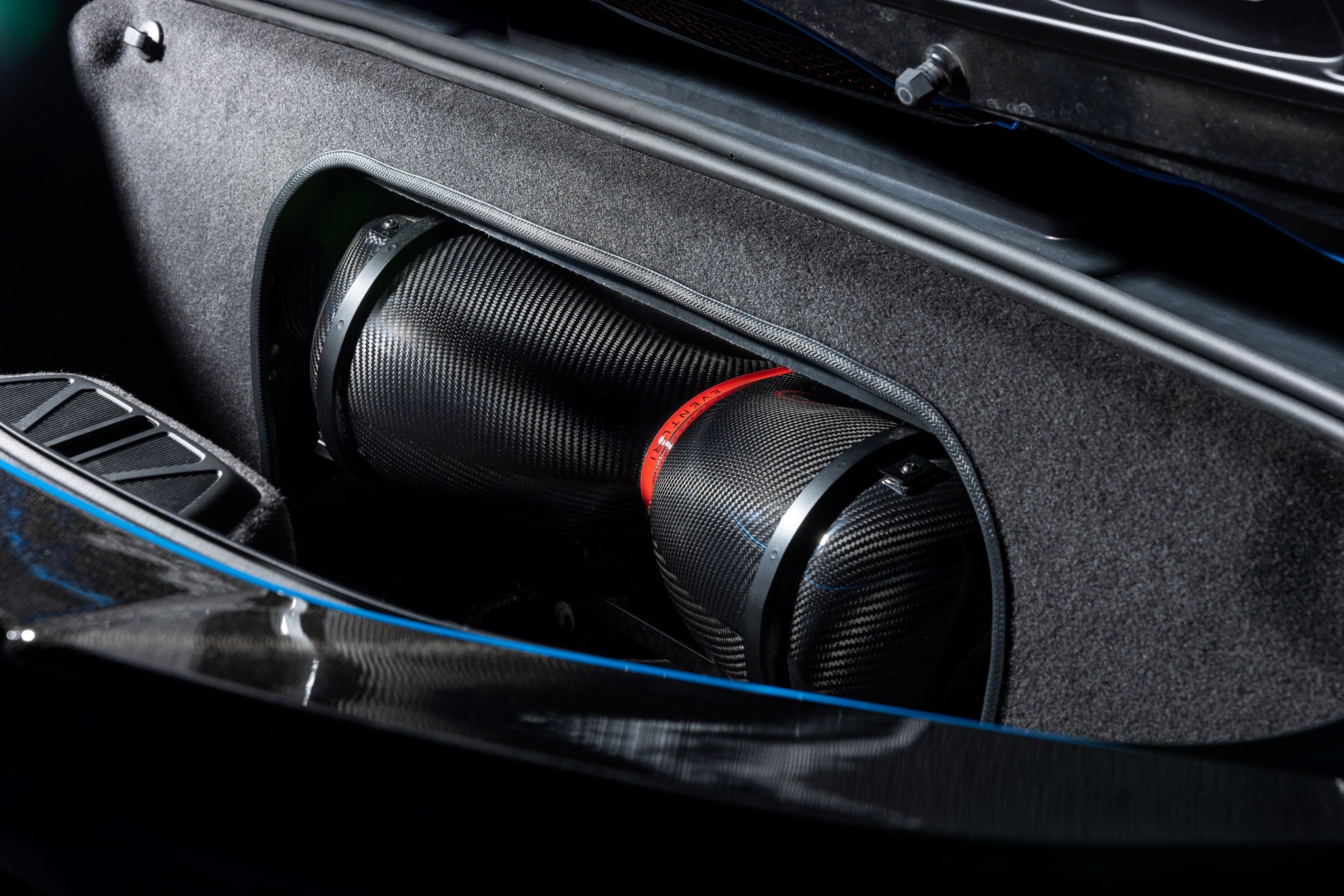 Eventuri carbon fiber intake system installed in a Chevrolet C8 Corvette Hard-Top Convertible with clear trunk panel
