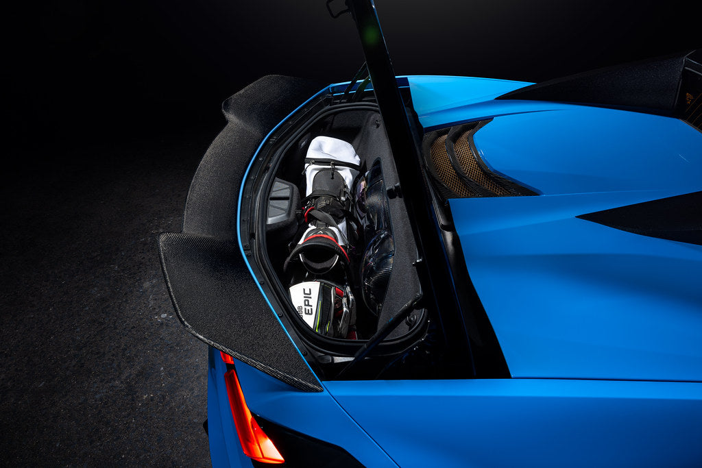 Eventuri carbon fiber intake system installed in a Chevrolet C8 Corvette Hard-Top Convertible with clear trunk panel with golf bag 