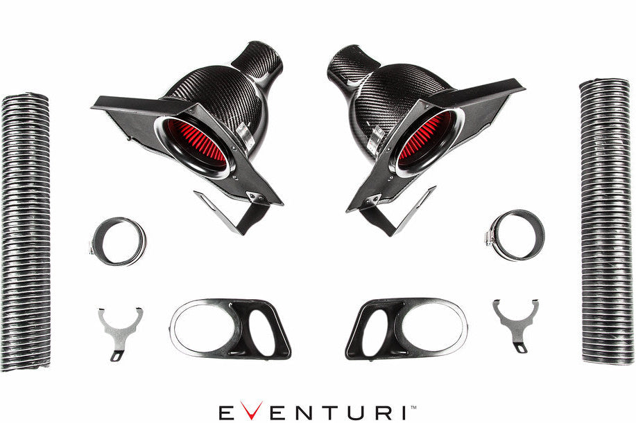 Eventuri BMW E39 M5 carbon intake system components laid out on a white background