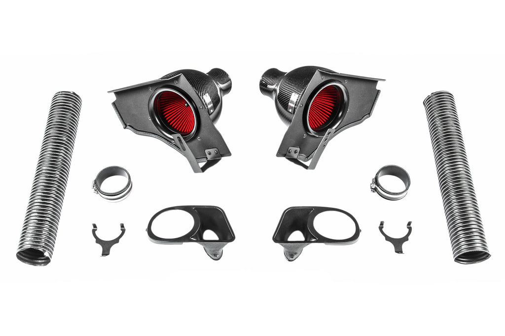 Eventuri BMW E39 M5 carbon intake system components laid out on white background showing all kit parts