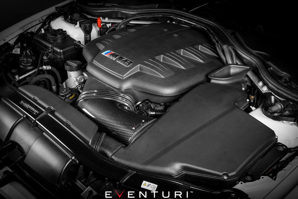 Eventuri black carbon intake system installed in BMW E9X M3 S65 engine bay, showcasing performance air intake for enhanced engine airflow.