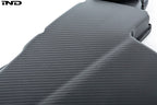 Close-up product photo of Eventuri E9X M3 S65 matte black carbon airbox lid on a white background
