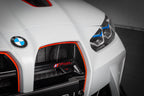 Eventuri black carbon intake scoops installed on BMW G8X M3 and M4, showcasing performance upgrade and aerodynamic design.