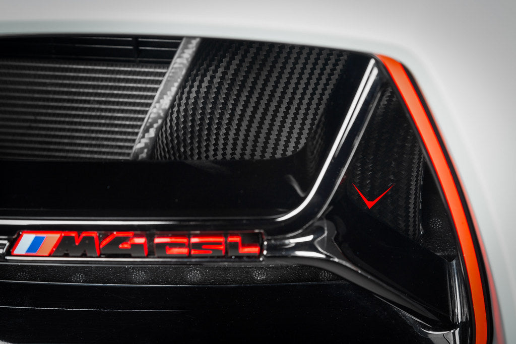 Eventuri black carbon intake scoop set installed on BMW G8X M3 and M4, performance upgrade for enhanced engine airflow.