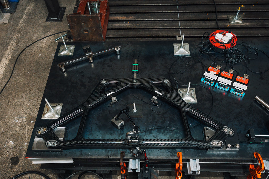 Independent laboratory test rig measuring deflection of Eventuri carbon strut brace