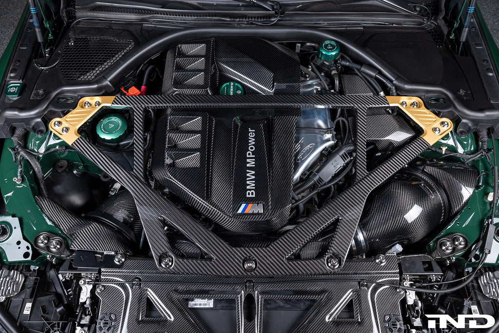 Eventuri black carbon intake system for BMW G8X M2, M3, M4 S58 engine shown installed in engine bay, enhancing performance.