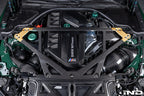 Eventuri black carbon intake system for BMW G8X M2, M3, M4 S58 engine shown installed in engine bay, enhancing performance.