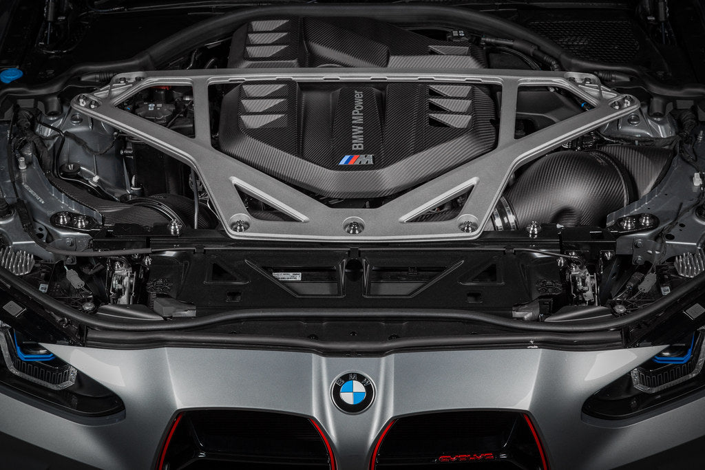 Eventuri black matte carbon intake system installed in engine bay for BMW G8X M2 M3 M4 S58 performance engine upgrade.