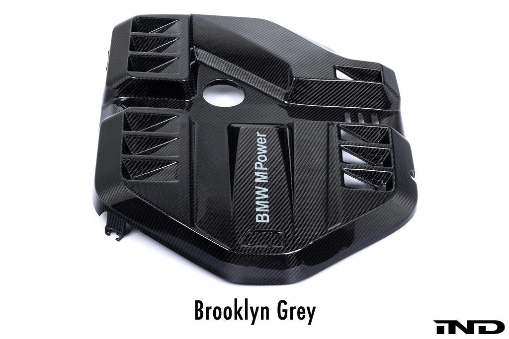 Eventuri G8X M2/M3/M4 S58 black carbon engine cover on a white background, showcasing sleek exterior design and high-quality craftsmanship.