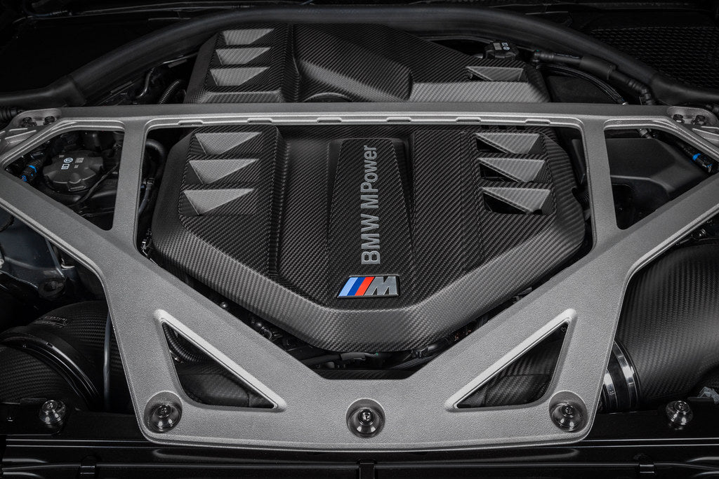 Eventuri black carbon engine cover installed in engine bay for G8X M2, M3, M4 S58 models, showcasing matte exterior finish.