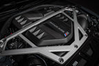 Eventuri black carbon engine cover installed in engine bay for BMW G8X M2, M3, M4 with S58 engine, matte finish.