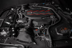 Car engine with a prominent brand logo on a dark background