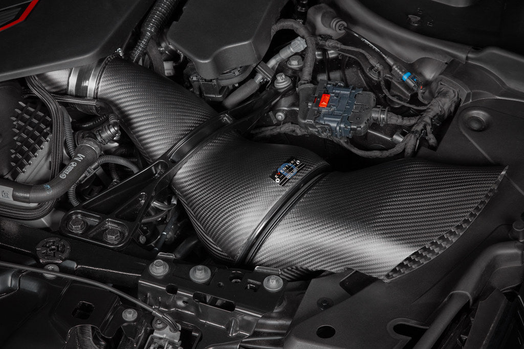 Close-up of a G90 M5 engine with carbon fiber intake installed