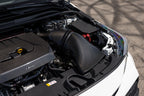 Eventuri GR Corolla carbon intake system installed in engine bay, showcasing a glossy, performance-focused intake setup.