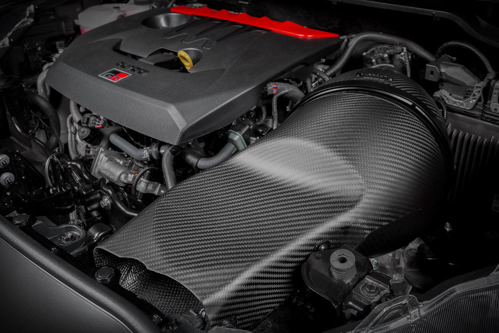 Eventuri GR Yaris Carbon Intake System installed, showcasing matte finish and performance-enhancing design for sporty engine airflow.