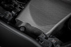 Eventuri GR Yaris carbon intake system installed, showcasing matte finish and performance-focused design on a compact sports car.