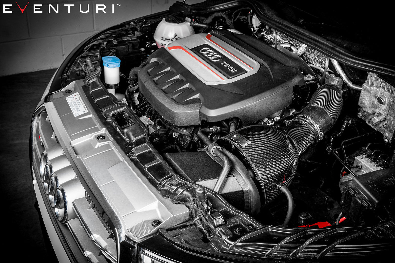 Angled view of Eventuri Audi 8X S1 carbon intake housing and duct assembly installed