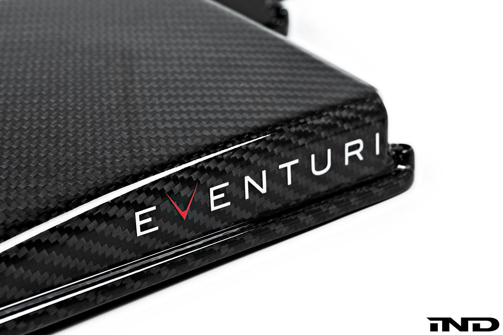 Eventuri black gloss carbon airbox lid for BMW E9X M3 (S65) performance engine, detailed close-up of the carbon finish.