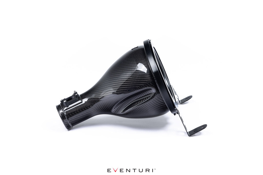 Eventuri GR Corolla carbon intake system installed on a white background, highlighting the performance-focused design and glossy finish.
