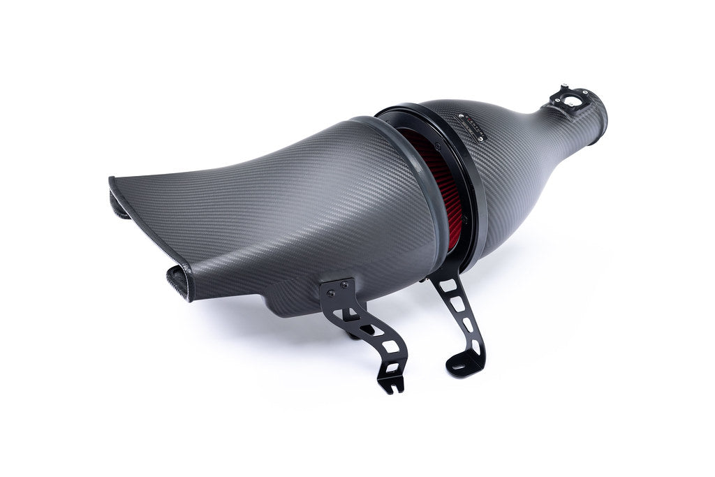 Eventuri GR Corolla carbon intake system installed, showcasing matte white finish and performance design on a Toyota GR Corolla.