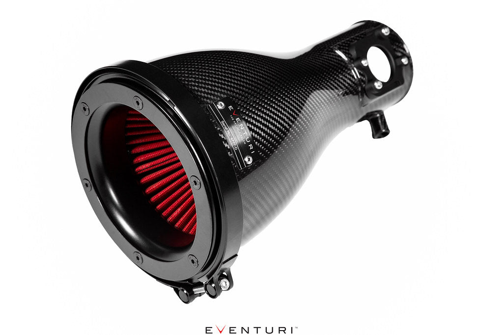 Close-up of Eventuri Toyota GR86 black carbon intake system with filter, showcasing performance air intake housing and sleek design.