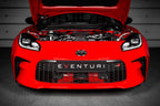 Eventuri Toyota GR86 black carbon intake system installed, showing the performance air intake with engine cover in a car engine bay.