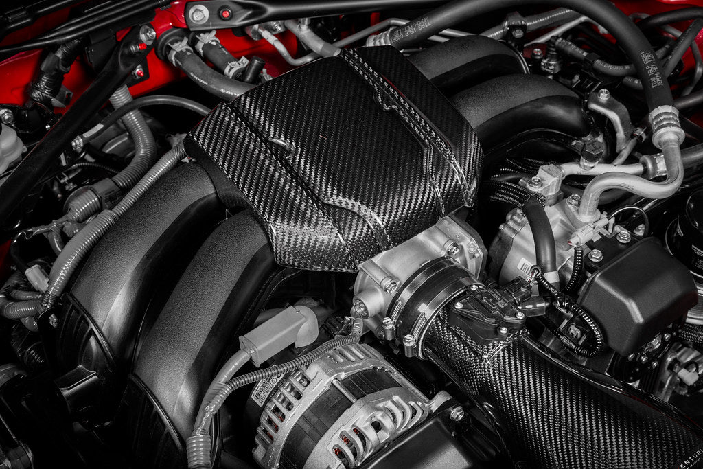 Eventuri Toyota GR86 black carbon intake system installed, showcasing sleek performance air intake for enhanced engine airflow.
