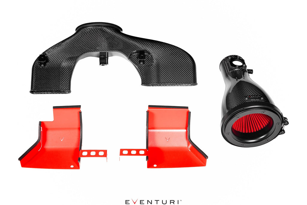 Uninstalled black carbon intake system for Toyota GR86 by Eventuri, showing glossy performance air intake components.