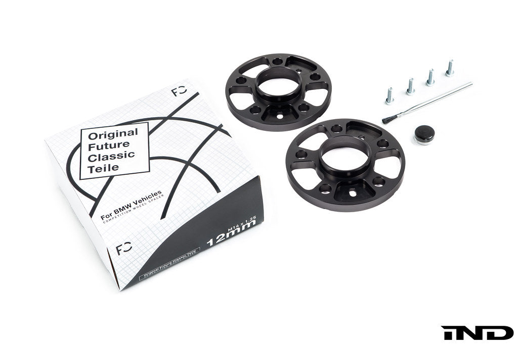 FC BMW 5x112 wheel spacer kit for stud conversion on white background hub centric black anodized spacer