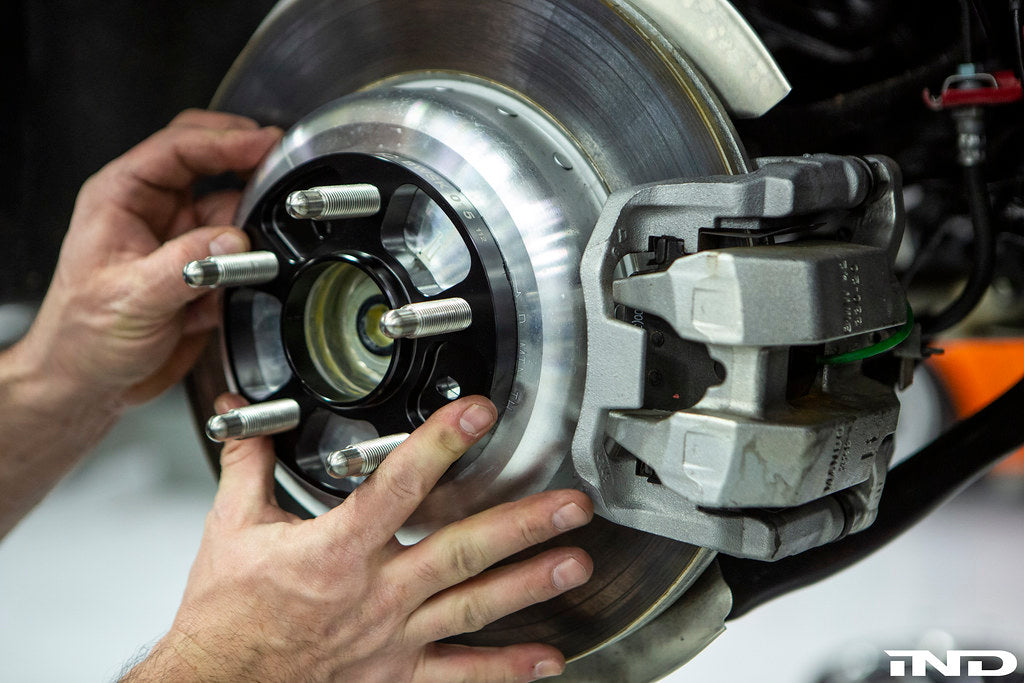 FC BMW 5x112 wheel spacer mounted on Supra hub for stud conversion showing hub centric fitment