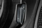 Goldenwrench Blackline Performance BMW M car E-Chassis hood latch handle installed, interior component in anthracite grey.