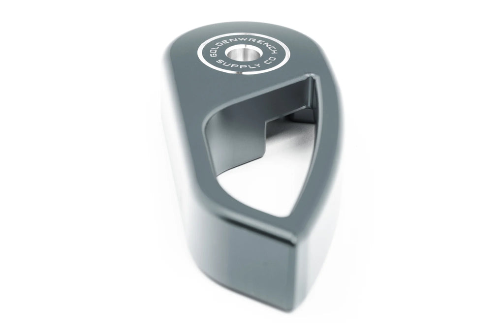 Goldenwrench Blackline Performance BMW M E-Chassis hood latch handle in anthracite grey, interior car part for BMW M models.