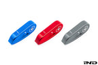 Goldenwrench Blackline Performance BMW M car E-chassis interior hood latch handle in red, blue, grey, and white on a plain background.