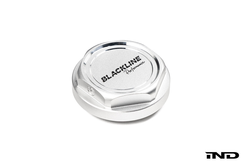 Goldenwrench BMW M Blackline Oil Cap Heritage Motorsport exterior accessory on white background, showcasing black and gold design details.