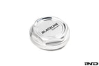 Goldenwrench BMW M Blackline Oil Cap Heritage Motorsport exterior accessory on white background, showcasing black and gold design details.