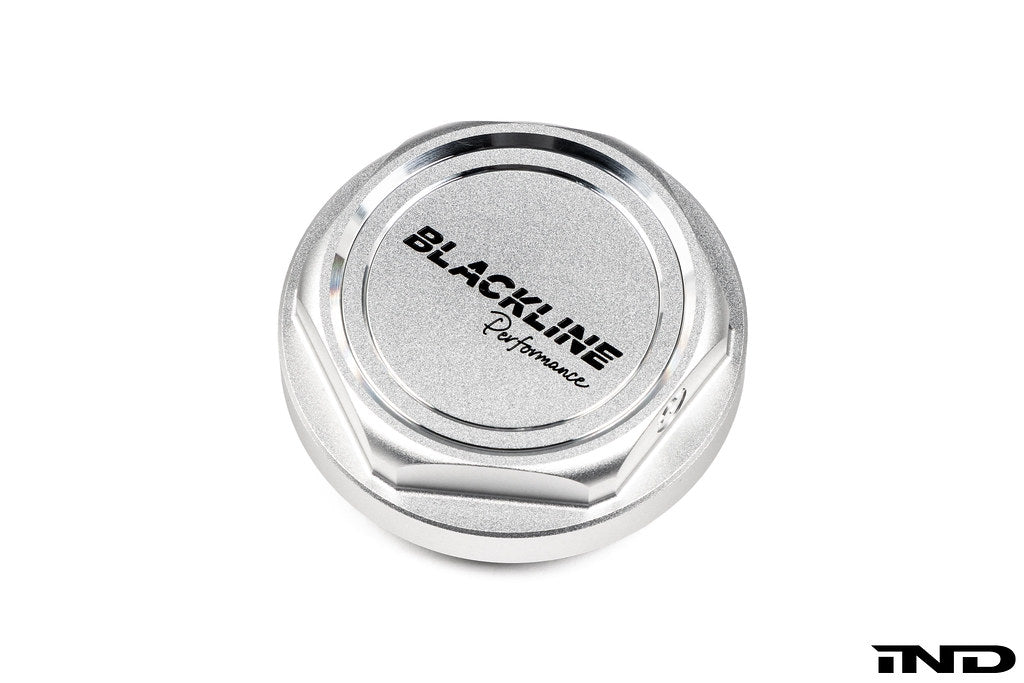 Goldenwrench BMW M Blackline Heritage Motorsport oil cap, exterior view, with black and gold details on a white background.