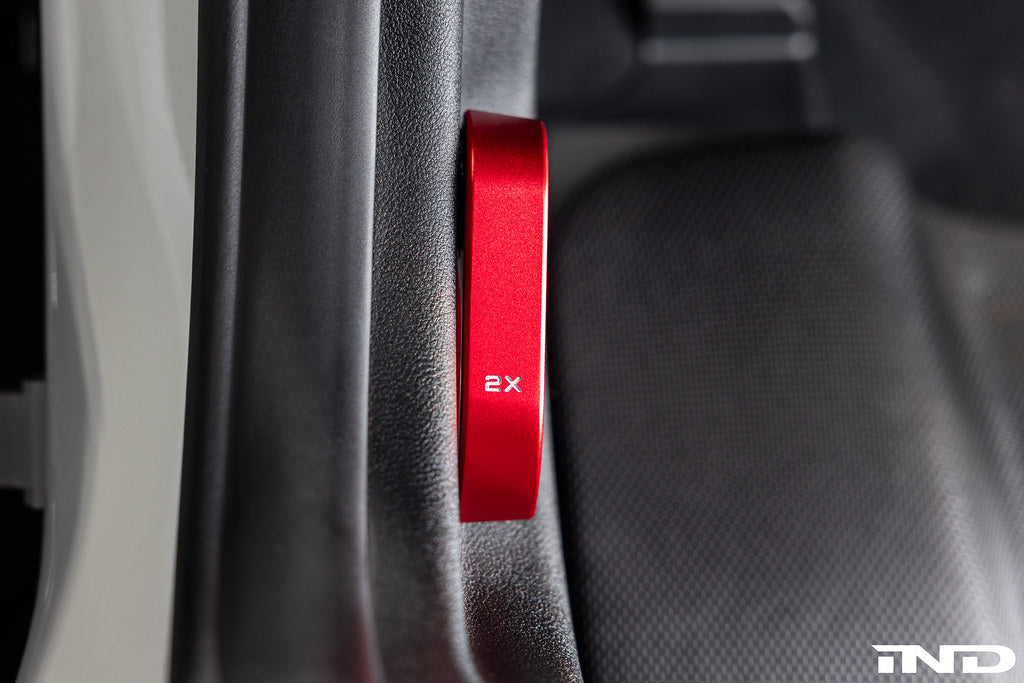 Goldenwrench red hood latch handle installed on BMW G-chassis M3 M4 M2 inside of BMW