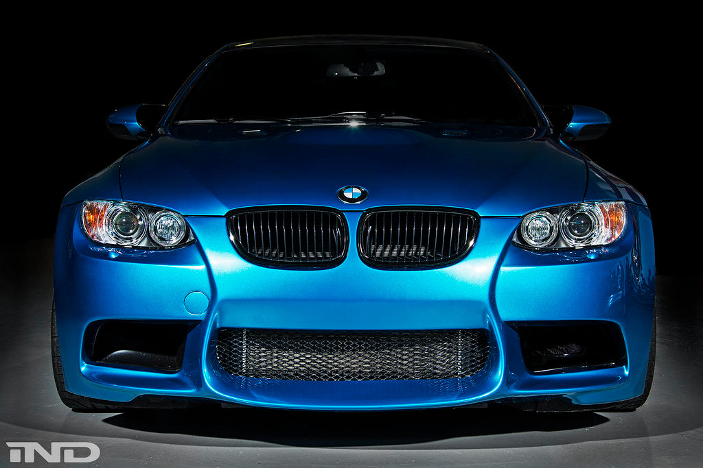 Exterior view of a gloss black front grille set for BMW E9X M3 by IND, showcasing the sleek, high-quality grille design.