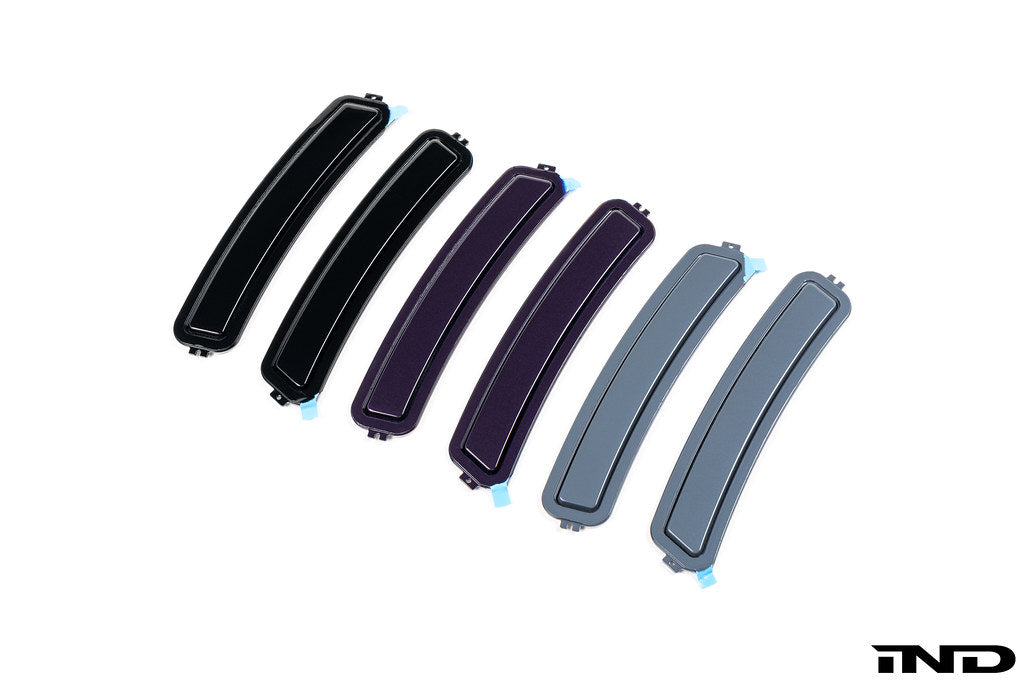 IND F74 2-Series Gran Coupe painted front reflector set on white background, showcasing sleek exterior design details.