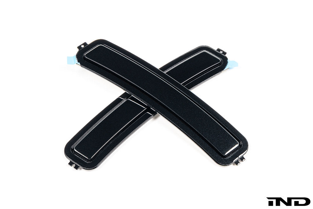 IND F74 2-Series Gran Coupe painted front reflector set mounted on exterior of white background vehicle