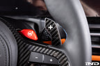 JQ Werks MadTrace BMW G-Chassis Clubsport magnetic carbon fiber shift paddles installed on steering wheel interior.