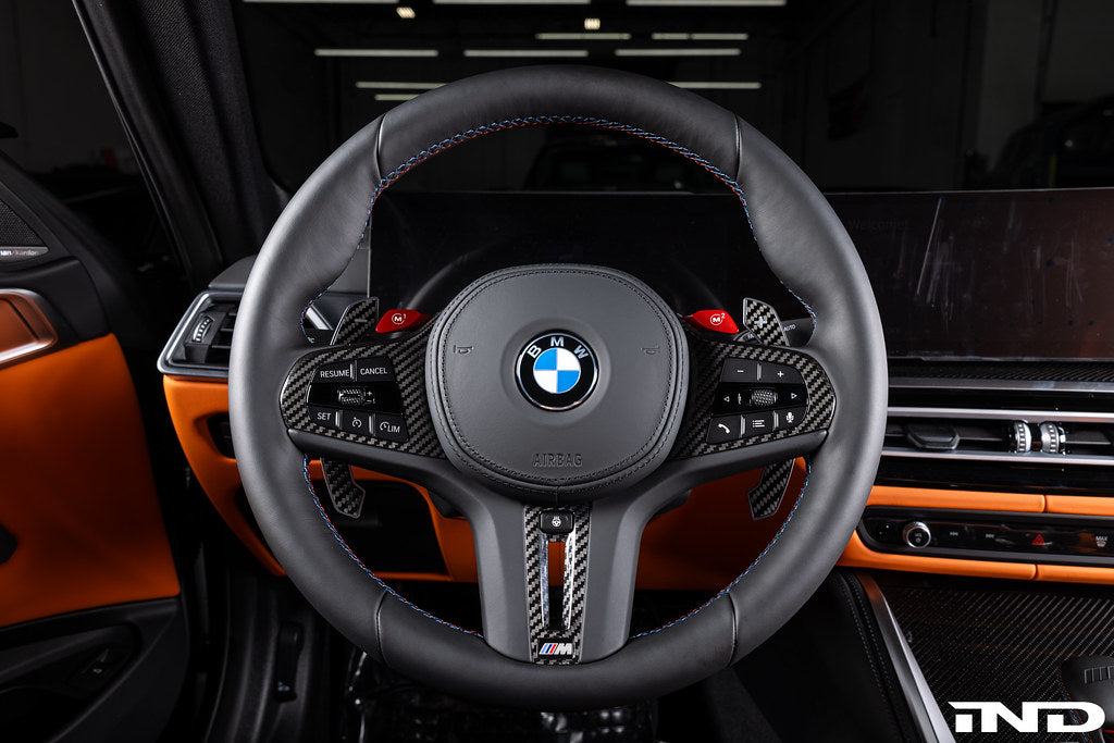 BMW G-Chassis Clubsport magnetic shift paddles by JQ Werks, carbon V2, installed on steering wheel interior for enhanced driving control.