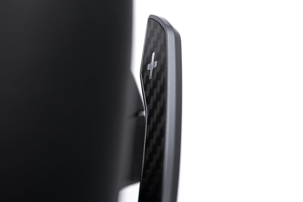 JQ Werks MadTrace BMW G-Chassis Clubsport Magnetic Shift Paddle Set in carbon V2 installed inside a car interior.