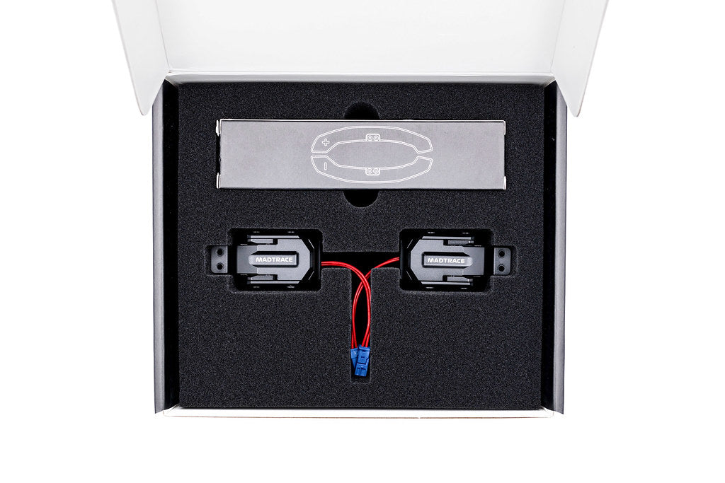 JQ Werks MadTrace BMW G-Chassis Clubsport Magnetic Shift Paddle Set in carbon V2 attached to car interior steering wheel.