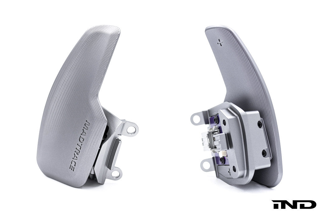 JQ Werks MadTrace C8 Corvette magnetic shift paddle set installed in interior, white background, showcasing sleek design and functionality.